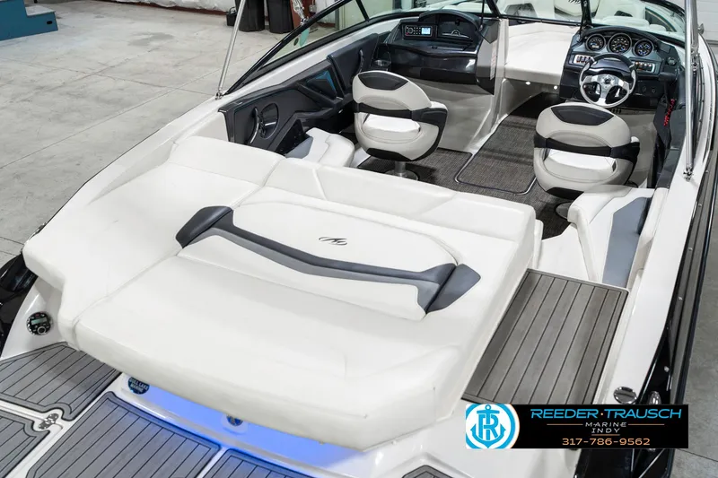 Slide: The Image of 2013 Monterey 232 SS boat interior with white seating and modern dashboard. - 14
