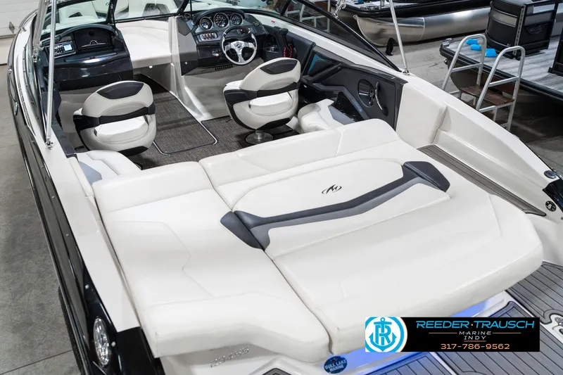 Slide: The Image of 2013 Monterey 232 SS boat interior with white seating and modern dashboard. - 15