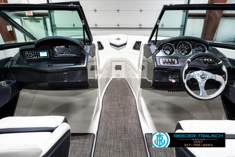 Slide: The Image of Interior view of a 2013 Monterey 232 SS boat dashboard and controls. - 17
