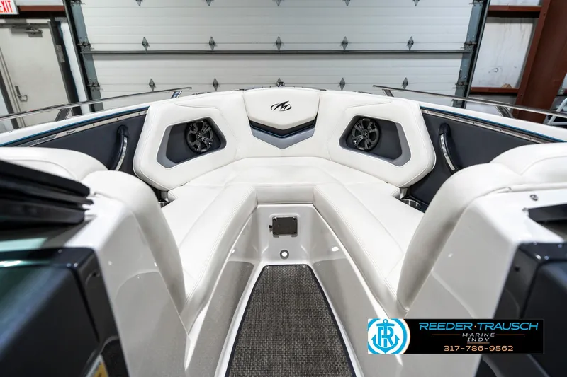Slide: The Image of Interior of a 2013 Monterey 232 SS boat with white seating and speakers. - 18