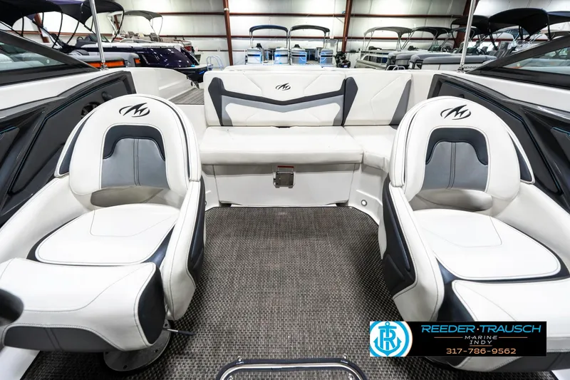 Slide: The Image of 2013 Monterey 232 SS boat interior with white seating and carpeted floor. - 20