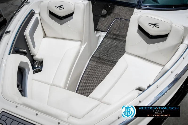 Slide: The Image of 2013 Monterey 232 SS boat interior with white seating and logo. - 23