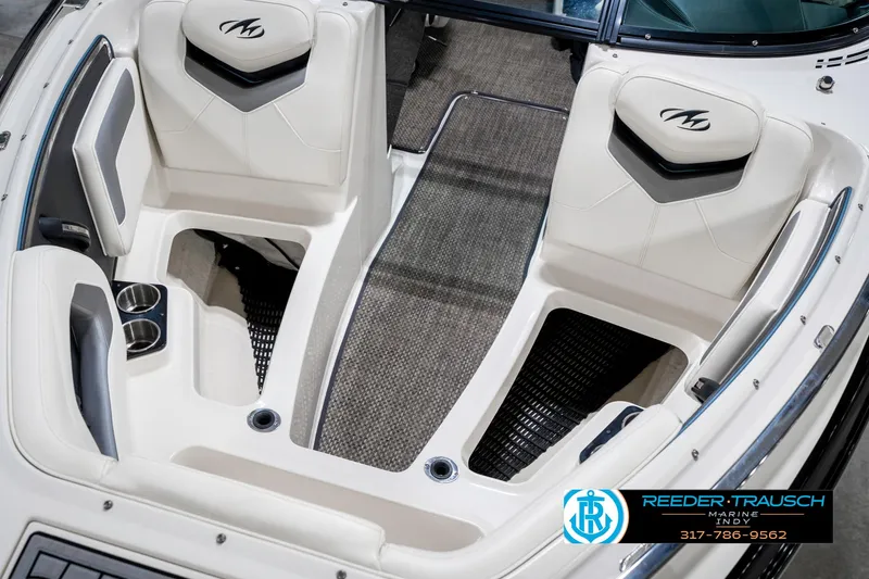 Slide: The Image of 2013 Monterey 232 SS boat interior with white seating and cup holders. - 24
