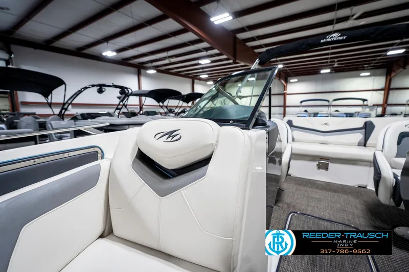 Slide: The Image of 2013 Monterey 232 SS boat interior with white seating in showroom. - 25