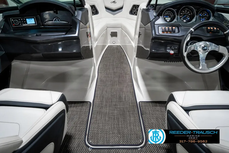 Slide: The Image of 2013 Monterey 232 SS boat interior with steering wheel and dashboard controls. - 27