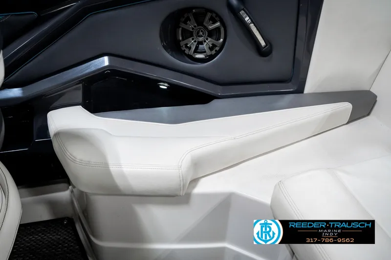 Slide: The Image of Interior of 2013 Monterey 232 SS boat, featuring speaker and seating area. - 29