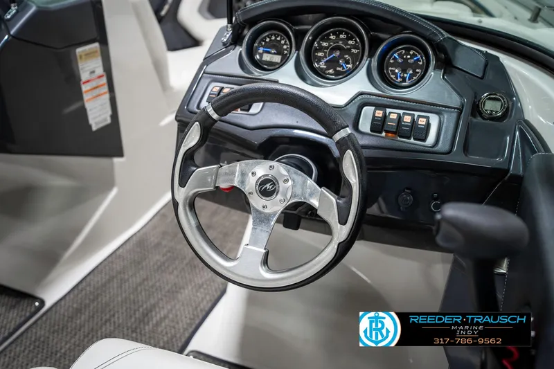 Slide: The Image of Steering wheel and dashboard of a 2013 Monterey 232 SS boat. - 36