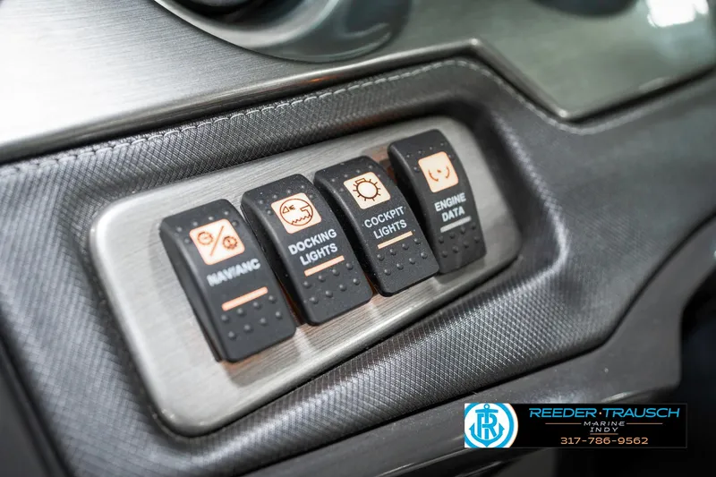 Slide: The Image of Control panel of a 2013 Monterey 232 SS boat with labeled switches. - 39