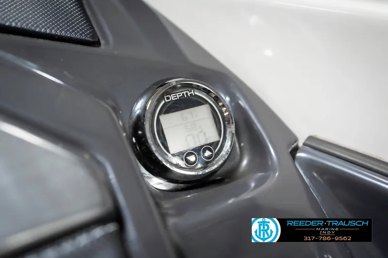 Slide: The Image of Depth gauge on 2013 Monterey 232 SS boat dashboard, featuring Reeder-Trausch Marine logo. - 43