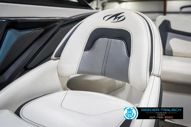 Slide: The Image of 2013 Monterey 232 SS boat seat with logo, featuring white and gray upholstery. - 45