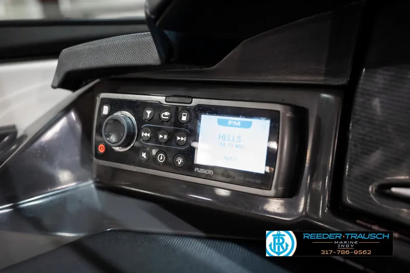 Slide: The Image of 2013 Monterey 232 SS boat dashboard with Fusion stereo system display. - 46