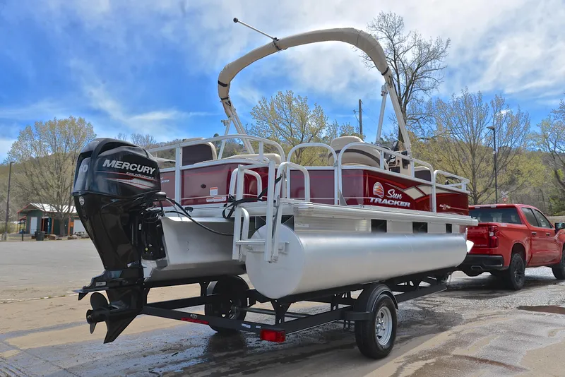Slide: The Image of 2018 Sun Tracker Bass Buggy 18 DLX pontoon boat on trailer with Mercury outboard motor. - 14