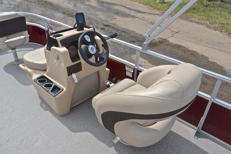Slide: The Image of 2018 Sun Tracker Bass Buggy 18 DLX boat interior with steering console and seating. - 26