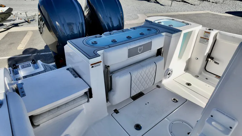 Slide: The Image of 2025 Sea Fox 288 Commander boat interior with dual engines and seating area. - 10