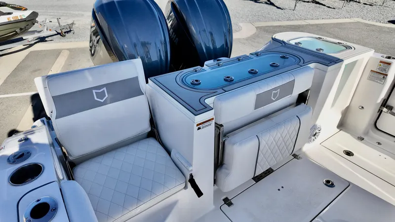 Slide: The Image of 2025 Sea Fox 288 Commander boat interior with seating and dual engines. - 11