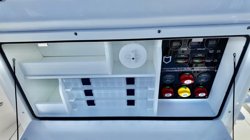 Slide: The Image of 2025 Sea Fox 288 Commander control panel with organized storage compartments. - 15