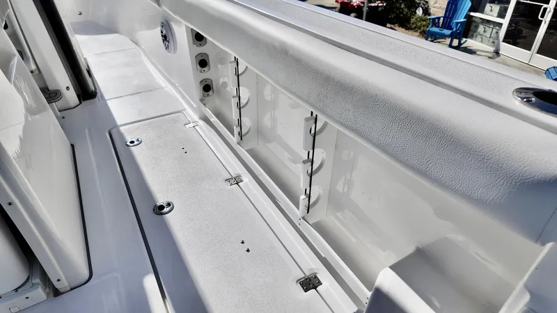 Slide: The Image of 2025 Sea Fox 288 Commander boat interior with storage compartments and seating. - 16