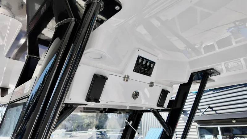 Slide: The Image of 2025 Sea Fox 288 Commander boat console with black supports and control panel. - 18