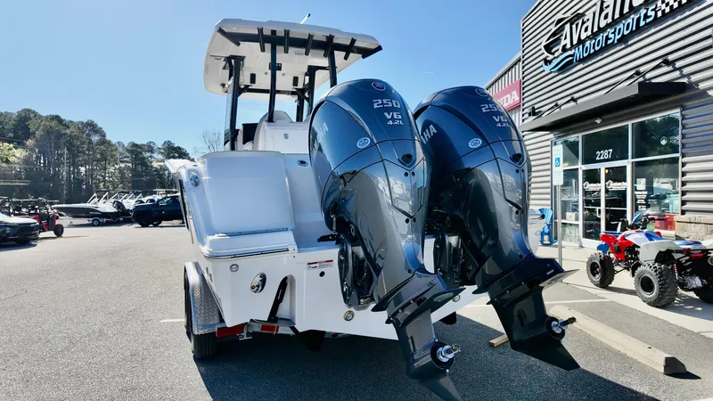 Slide: The Image of 2025 Sea Fox 288 Commander boat with dual Yamaha 250 engines at dealership. - 3