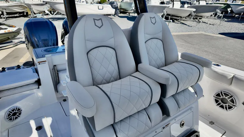 Slide: The Image of 2025 Sea Fox 288 Commander boat seats with quilted design and armrests. - 7