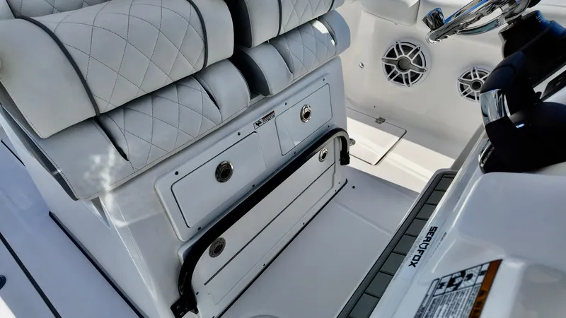 Slide: The Image of 2025 Sea Fox 288 Commander interior with quilted seating and storage compartments. - 8