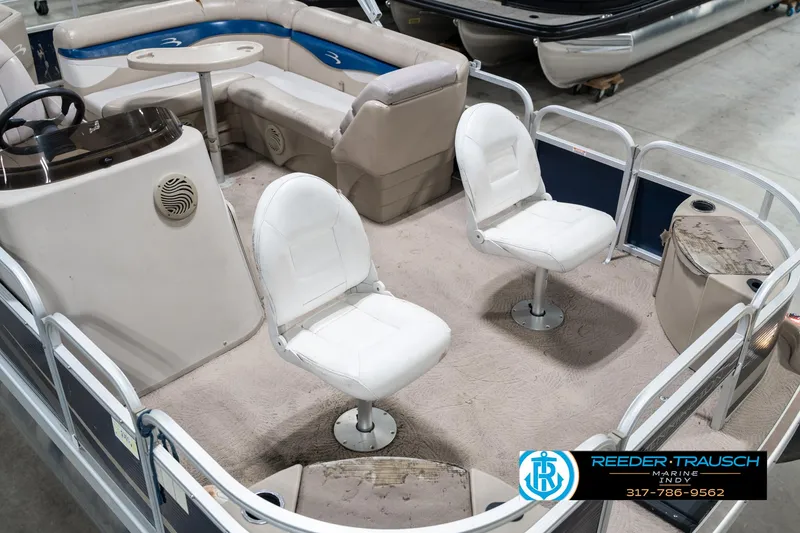 Slide: The Image of 2011 Bennington 20 SFI pontoon boat interior with seating and steering console. - 13
