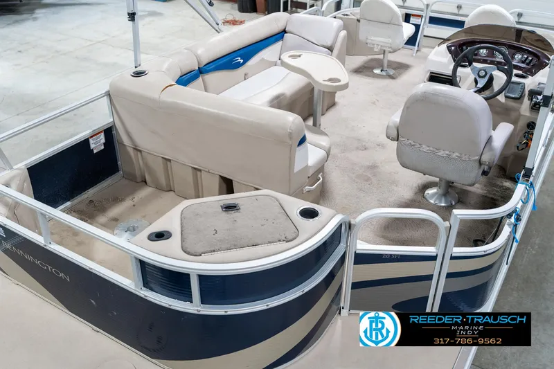 Slide: The Image of 2011 Bennington 20 SFI pontoon boat interior with seating and steering console. - 14