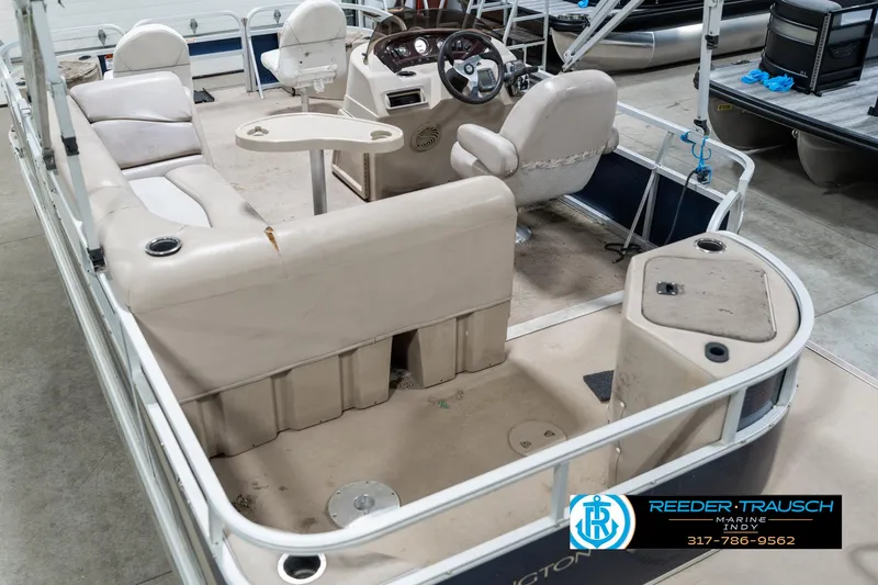 Slide: The Image of 2011 Bennington 20 SFI pontoon boat interior with seating and steering console. - 15