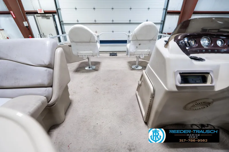 Slide: The Image of Interior of a 2011 Bennington 20 SFI boat with seating and control panel. - 20