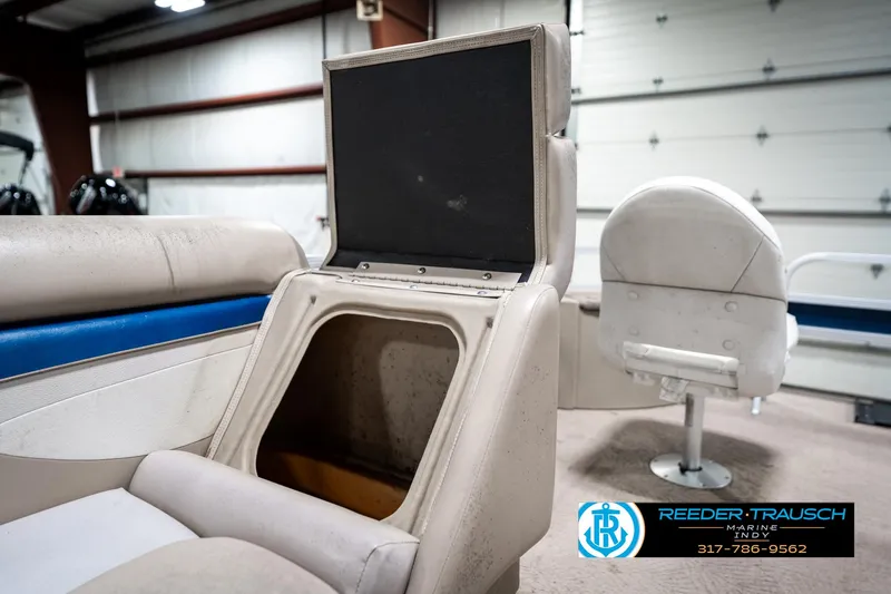Slide: The Image of 2011 Bennington 20 SFI boat interior with open storage compartment and seating. - 25