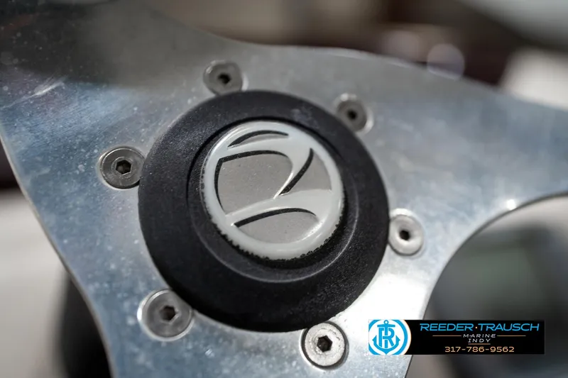 Slide: The Image of Close-up of 2011 Bennington 20 SFI steering wheel with logo and metallic finish. - 34