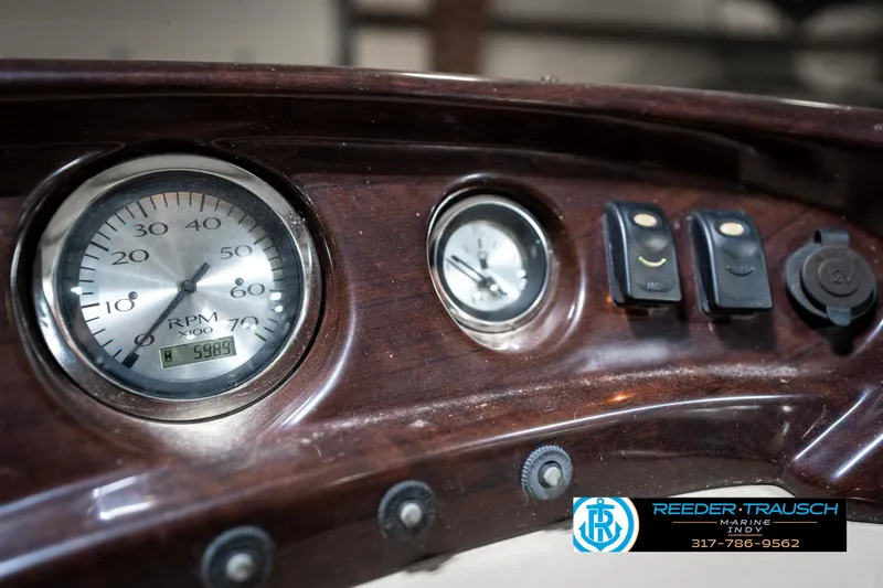 Slide: The Image of Dashboard of a 2011 Bennington 20 SFI boat with gauges and controls. - 36