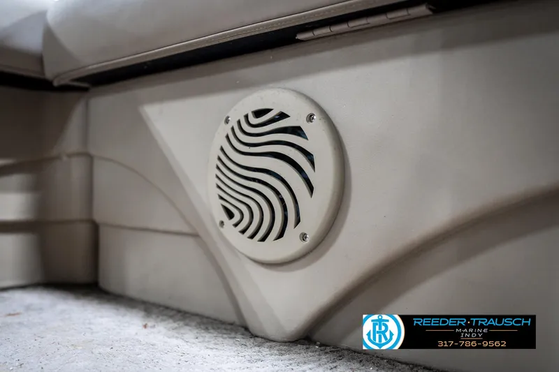 Slide: The Image of Speaker on a 2011 Bennington 20 SFI boat interior, featuring beige upholstery. - 41