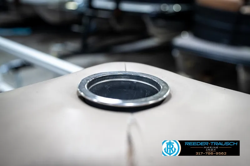 Slide: The Image of 2011 Bennington 20 SFI boat detail with Reeder-Trausch logo visible. - 43