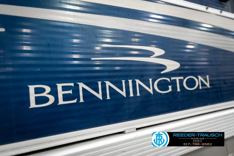 Slide: The Image of Close-up of 2011 Bennington 20 SFI boat logo on blue surface. - 49