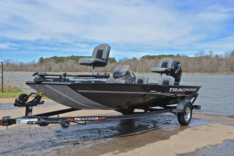 Slide: The Image of 2023 Bass Tracker Pro 170 boat on trailer by a lake. - 10