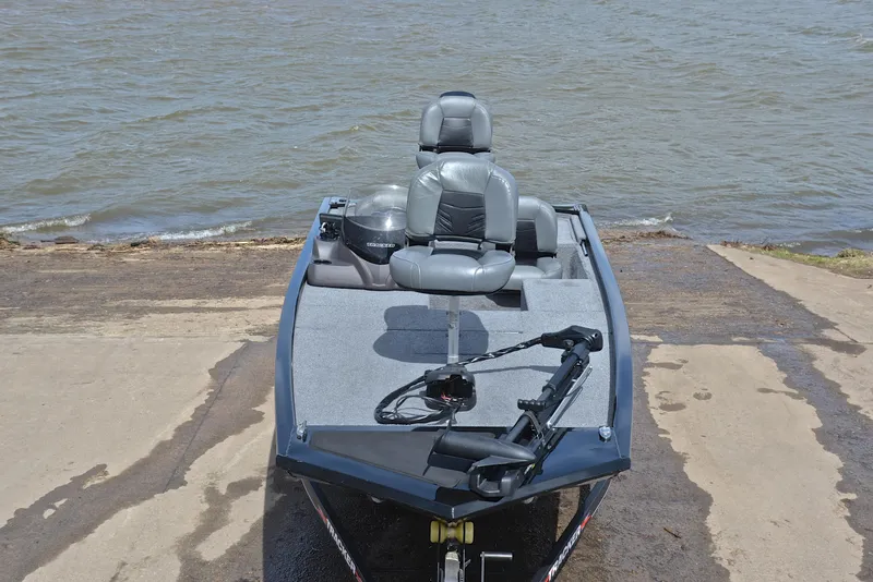 Slide: The Image of 2023 Bass Tracker Pro 170 boat on a concrete ramp by the water. - 17