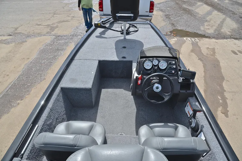 Slide: The Image of 2023 Bass Tracker Pro 170 boat interior with steering console and seating. - 20