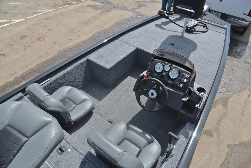 Slide: The Image of 2023 Bass Tracker Pro 170 boat interior with steering console and seating. - 21
