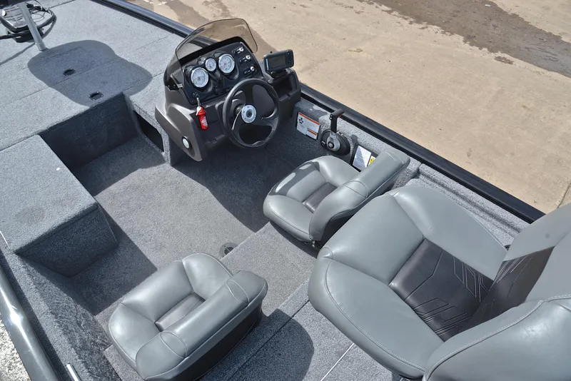 Slide: The Image of 2023 Bass Tracker Pro 170 boat interior with steering console and seating. - 22