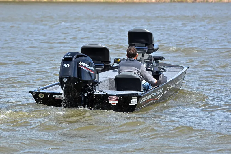 Slide: The Image of 2023 Bass Tracker Pro 170 boat on water, rear view with Mercury engine. - 8