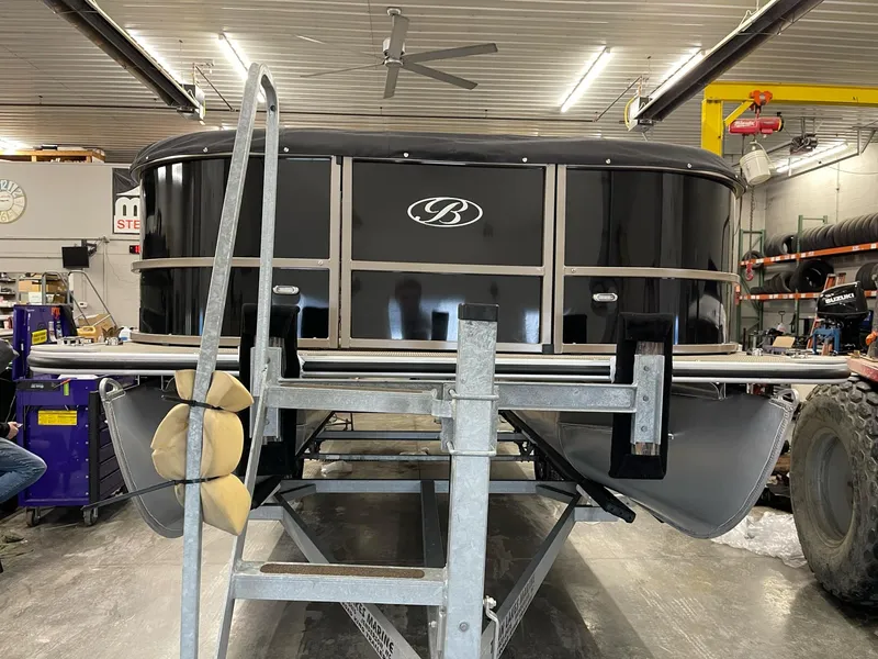 Slide: The Image of 2021 Bentley Pontoons Legacy 200 Cruise RE in a workshop setting. - 1