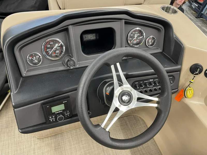 Slide: The Image of 2021 Bentley Pontoons Legacy 200 Cruise RE dashboard with steering wheel and gauges. - 12