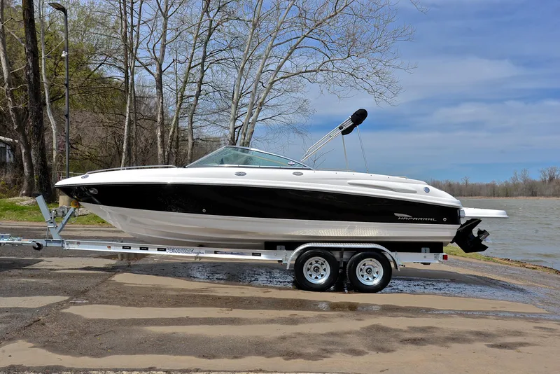 Slide: The Image of 2004 Chaparral 220 SSi boat on trailer by a lakeside, ready for launch. - 11