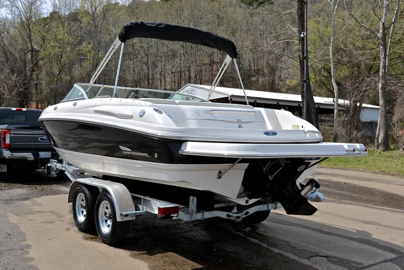 Slide: The Image of 2004 Chaparral 220 SSi boat on trailer, parked outdoors. - 12