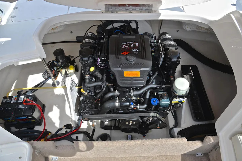 Slide: The Image of Engine compartment of a 2004 Chaparral 220 SSi boat, showcasing detailed components. - 27