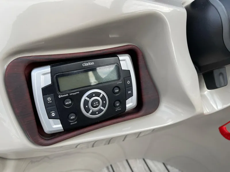 Slide: The Image of Clarion audio system in 2016 Berkshire 233RFX STS boat dashboard. - 15