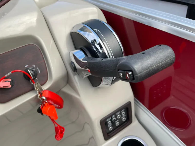 Slide: The Image of Throttle control and ignition switch on a 2016 Berkshire 233RFX STS boat. - 18