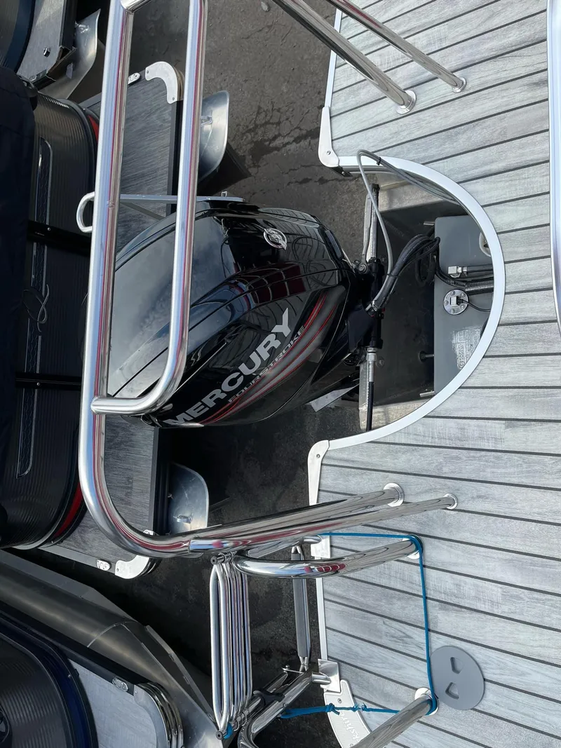 Slide: The Image of 2016 Berkshire 233RFX STS boat with Mercury outboard motor, rear deck view. - 24