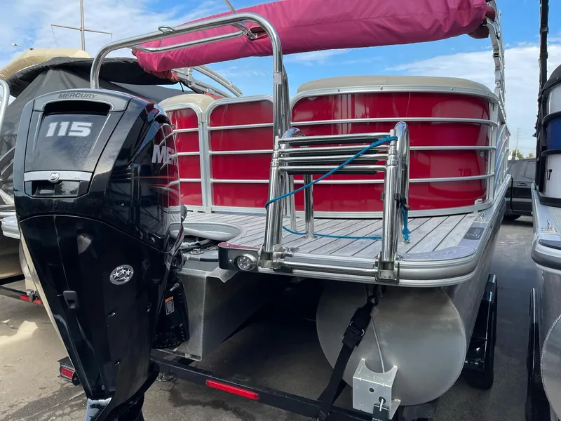 Slide: The Image of 2016 Berkshire 233RFX STS pontoon boat with Mercury 115 outboard motor, docked. - 5